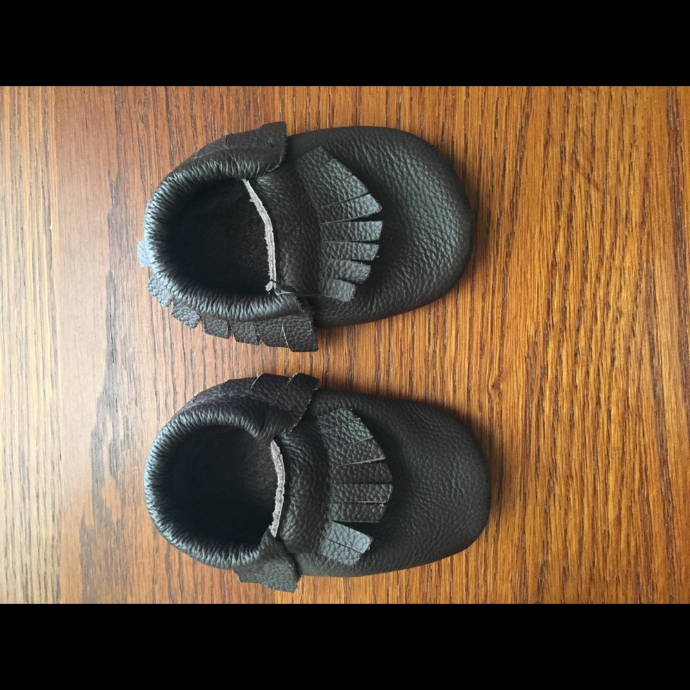 Brown leather moccasins and knee pads